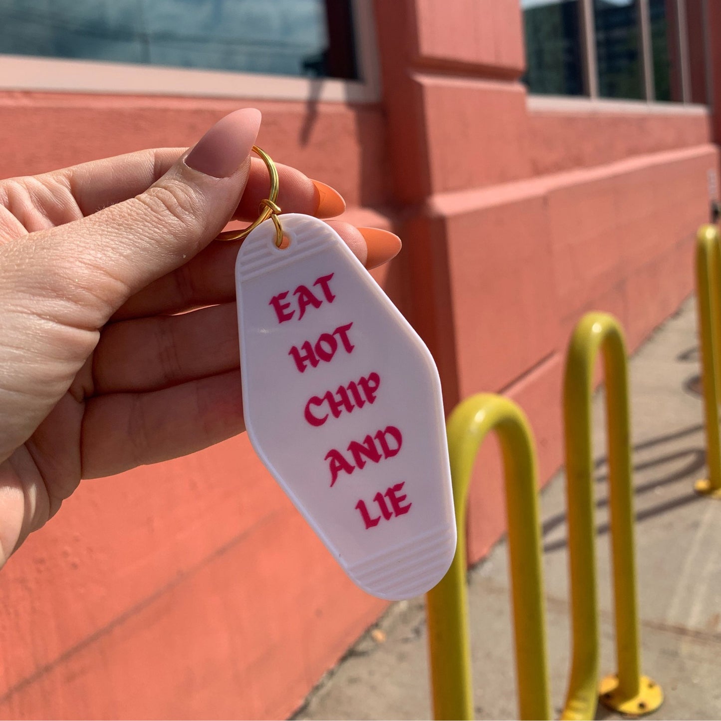 Eat Hot Chip and Lie Motel Style Keychain in White